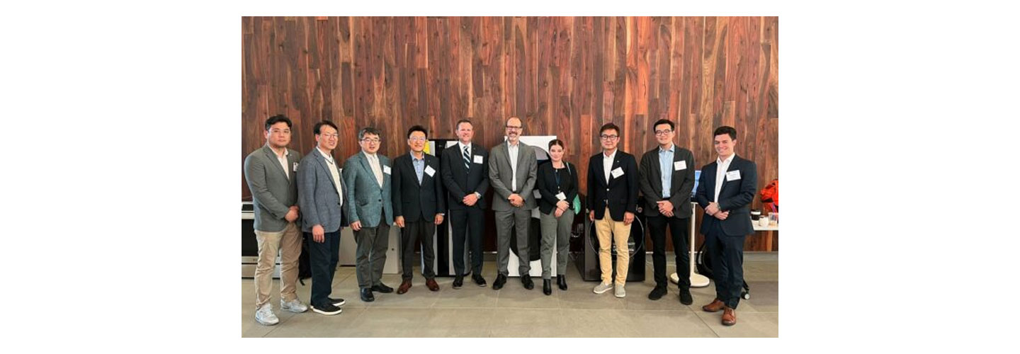 LG USA employees posing together for a photo during the summit