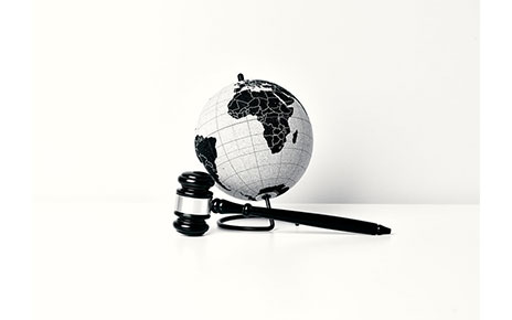 An image of a judge hammer and a globe depicting that LG is taking a firm stance on patent infringement