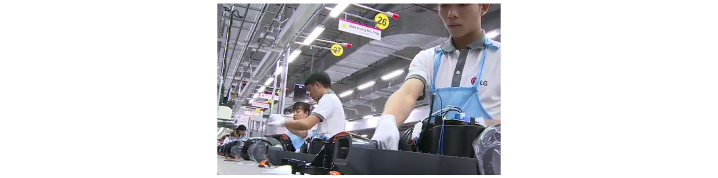 LG's Vietnamese employees assembling electronic appliances inside the company's Haiphong Campus.