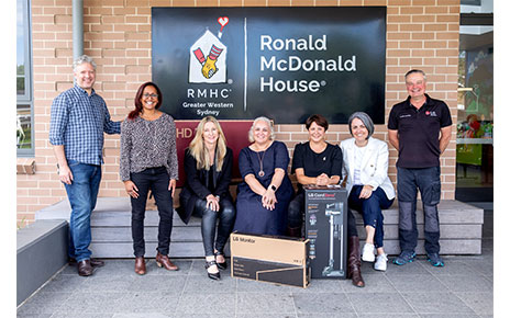 The staff of RMHC posing together for a photo with donated LG products