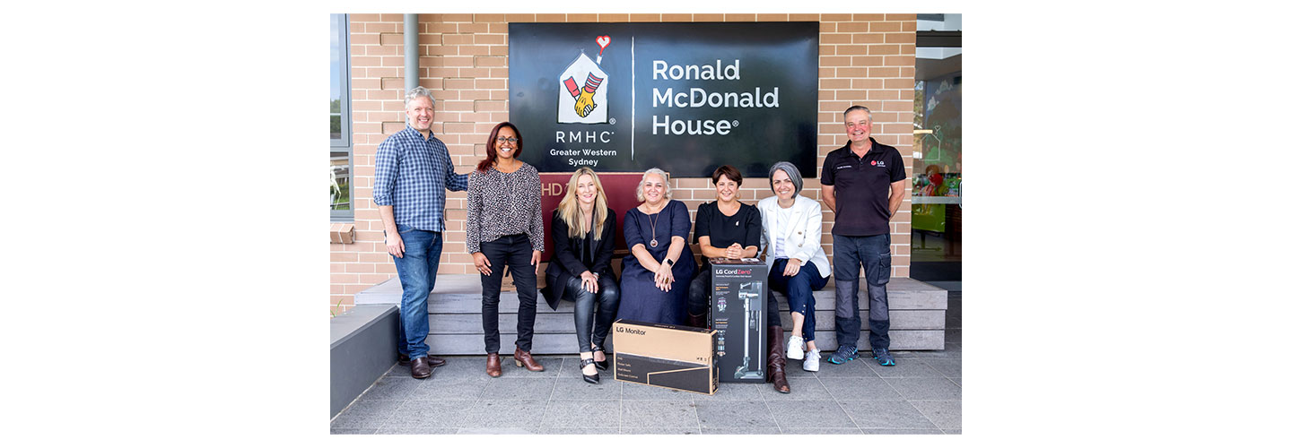 The staff of RMHC posing together for a photo with donated LG products