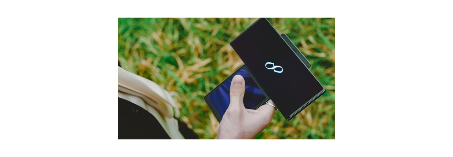 Taemin, another member of SuperM, looks at a symbol displayed on LG WING in Swivel Mode during SuperM's music video