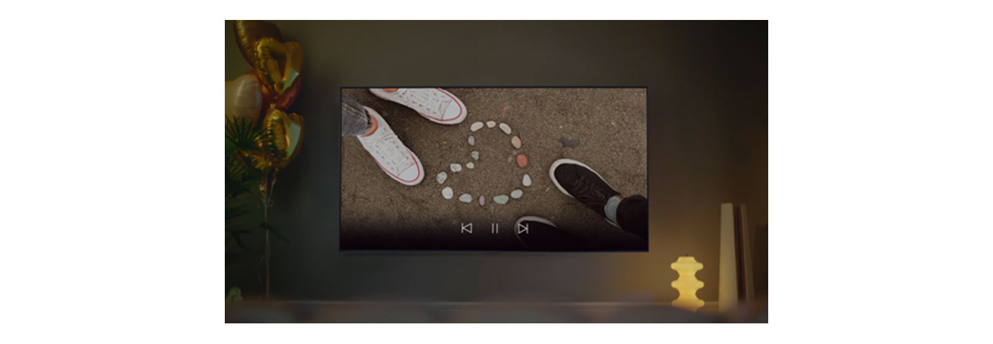 A wall-mounted LG TV displaying content 