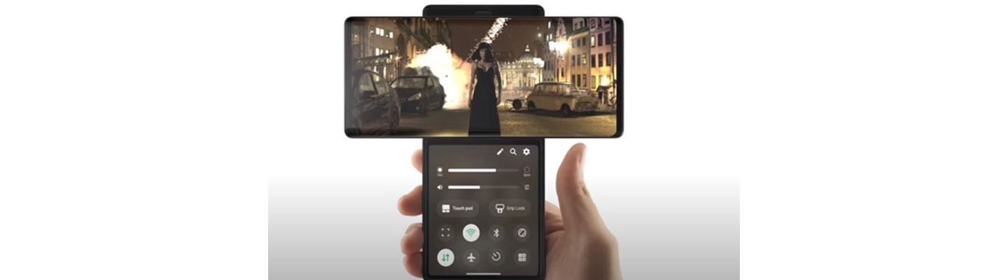 The user watches a video while managing the Media Controller on its smaller second screen via Swivel Mode