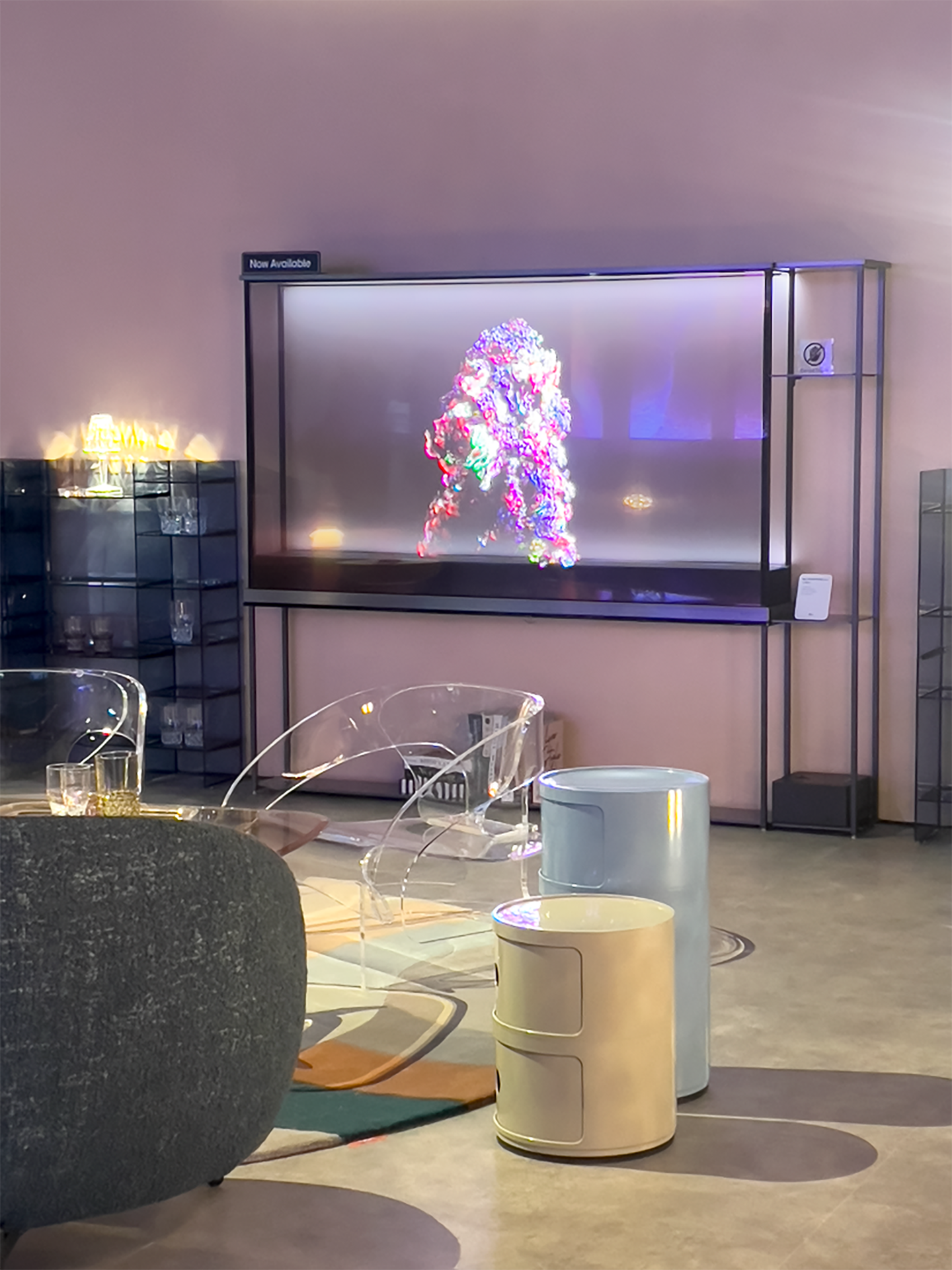 A picture of Kartell products and the LG Signature OLED T displaying artwork