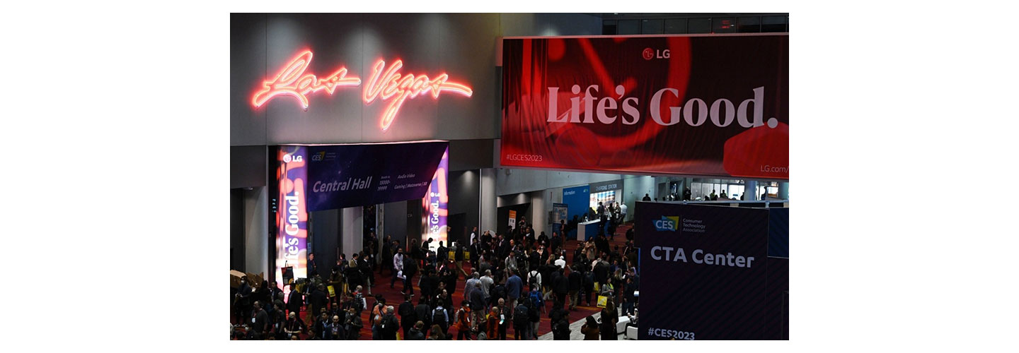 The entrance of LG booth at CES 2023 where a promotional LG poster is hanging from above