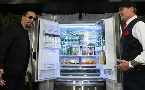 World-famous rappers, Vanilla Ice and Ice-T, hold open the doors of the LG InstaView™ Door-in-Door® Refrigerator with Craft Ice at the Craft Ice House hosted by LG event.