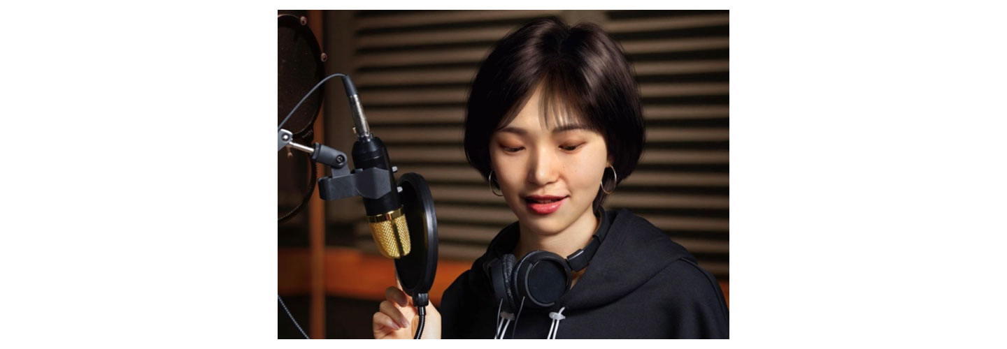 Virtual artist Reah Keem recording a song in the studio.
