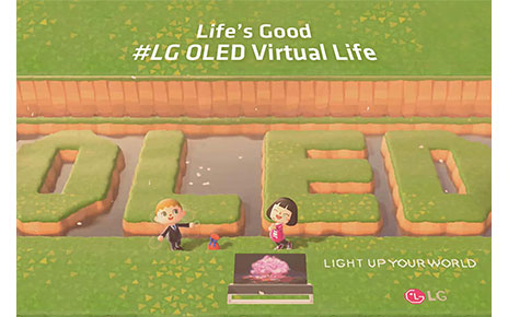 Two player avatars in popular Nintendo game 'Animal Crossing' pose with the LG OLED TV and 'OLED’ lettering, which have been terraformed into the pond behind them.