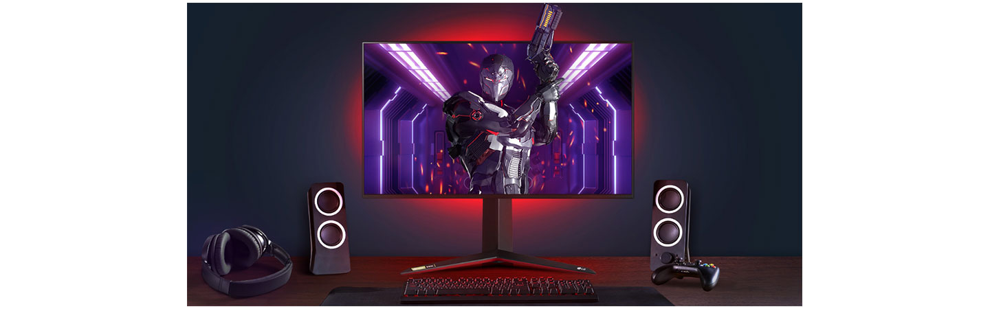 A complete gaming setup with LG UltraGear as the centerpiece, the monitor's back lights shining bright red and the game character bursting out of the display