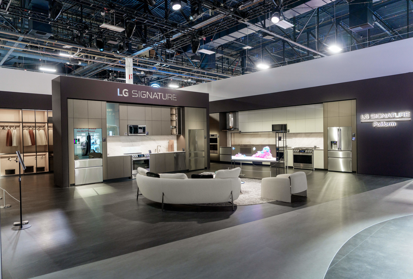 A wide view of the Mastery in Tune zone shows various LG SIGNATURE products in a curated living space.
