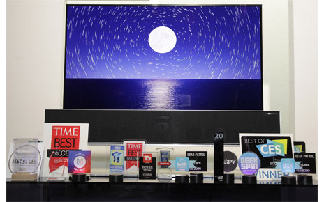 The LG SIGNATURE OLED TV R displayed behind numerous awards LG Electronics (LG) won during a record-breaking CES for the company