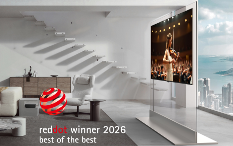An LG OLED evo W6 Wallpaper TV displaying a violin performance is attached to a transparent stand, with a "Red Dot Winner 2026 Best of the Best" graphic in the corner.