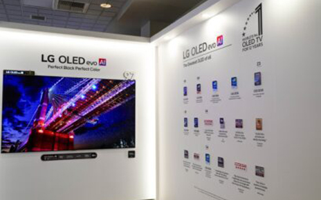 A photo of LG OLED evo TVs displayed on a wall