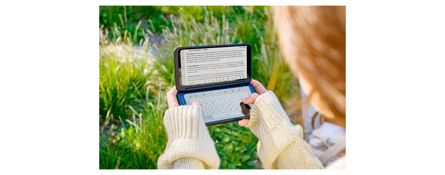 A woman holds the LG G8X ThinQ and the LG Dual Screen horizontally, with the Memo app on the Dual Screen and the LG Smart Keyboard on the main screen