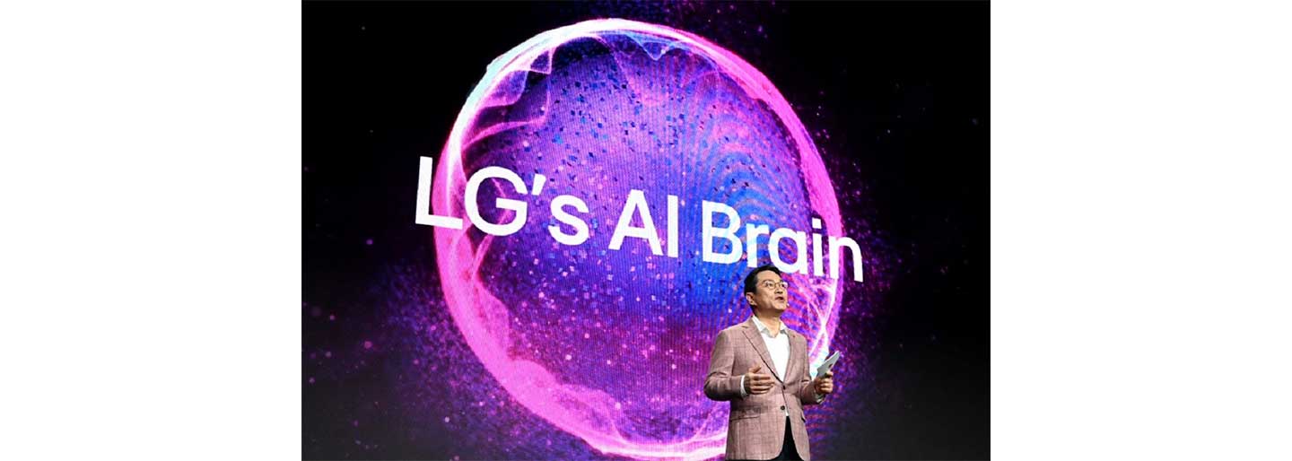 A photo of LG's CEO William Cho talking in front of a big display that has the words 'LG's AI Brain'