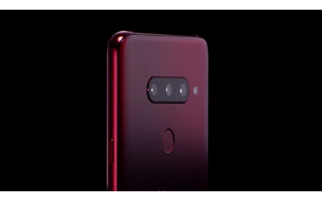 The top, rear half of the LG V40 ThinQ in Carmine Red, showing off the microscopic pits on the rear glass of the LG etched by employing the proprietary Silky Blast™ treatment