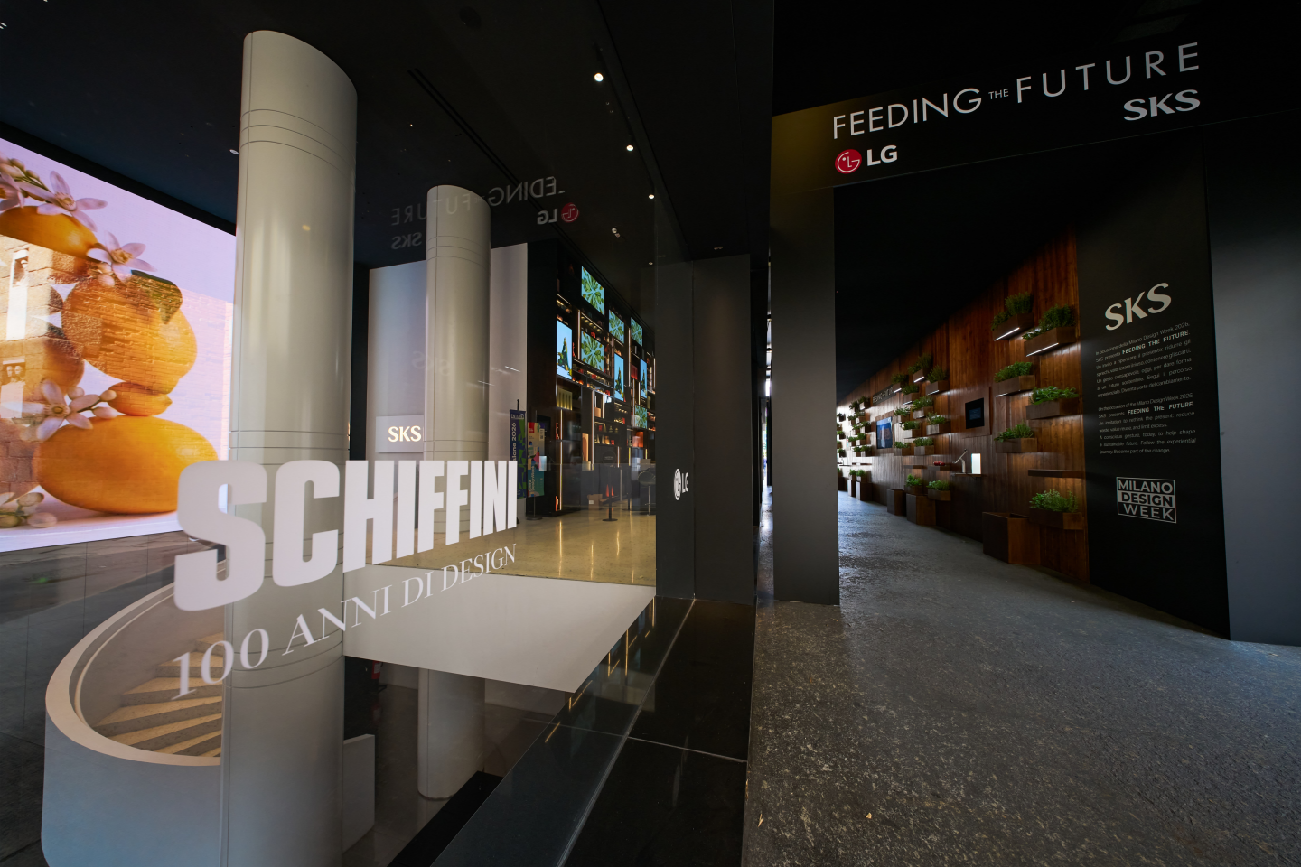At the entrance to the SKS showroom, a glass sign reading “SCHIFFINI” marks the entrance to an exhibition space, with SKS branding and signage reading “Feeding the Future.” 