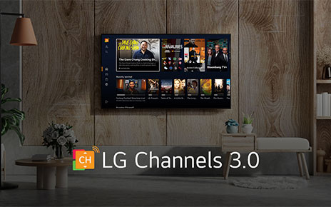 An LG OLED TV in a wood-themed living room displaying the home screen of the new LG Channels 3.0