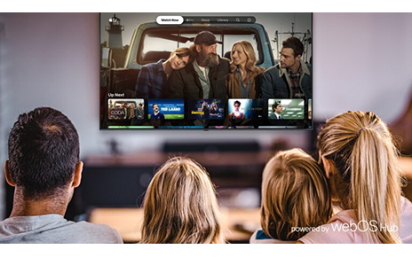 A family of four browsing the Apple TV Watch Now page via the newly released LG webOS Hub 2.0