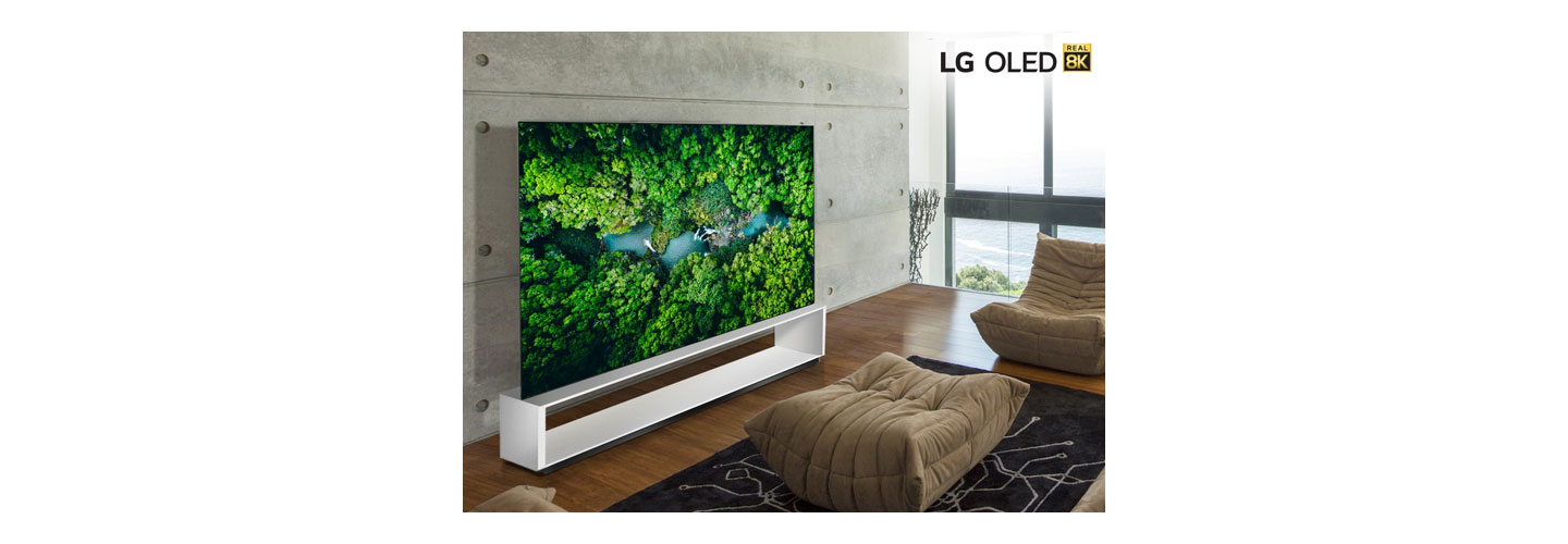 LG 8K OLED TV model 88 OLED ZX in a modern living room while displaying the vivid colors of a dense green forest.