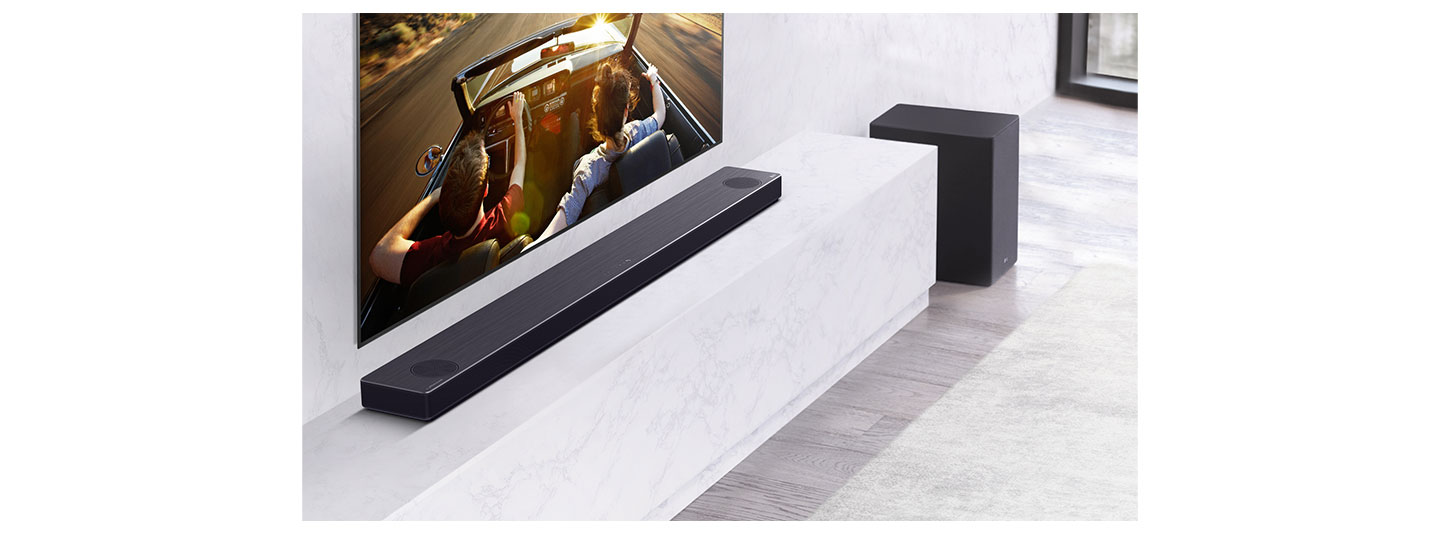 LG Soundbar model SN11RG installed on a shelf under an LG TV as it delivers truly dynamic sounds