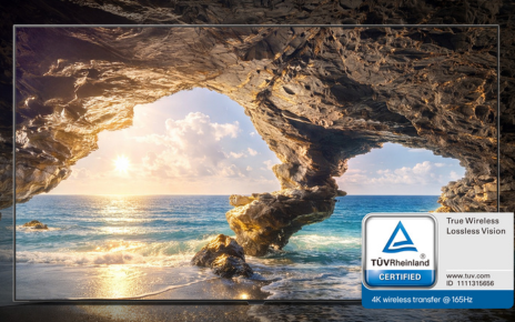 An LG OLED evo W6 displays the sunset from a coastal cave with a TÜV Rheinland “True Wireless Lossless Vision” certification badge.