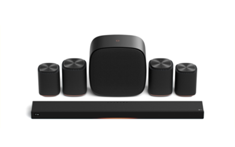 The LG Sound Suite features a sleek soundbar, four cylindrical satellite speakers and a rounded square subwoofer, set against a white background.