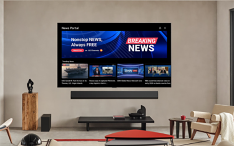 An LG Smart TV and soundbar are mounted to the wall of a modern living room, with the screen displaying the webOS News Portal interface.