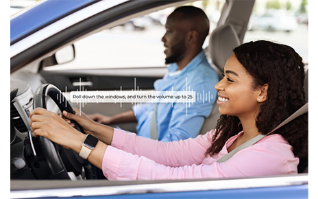 Smiling beautiful African American woman driving modern luxury car, happy young man sitting on the front passenger seat, looking on the road