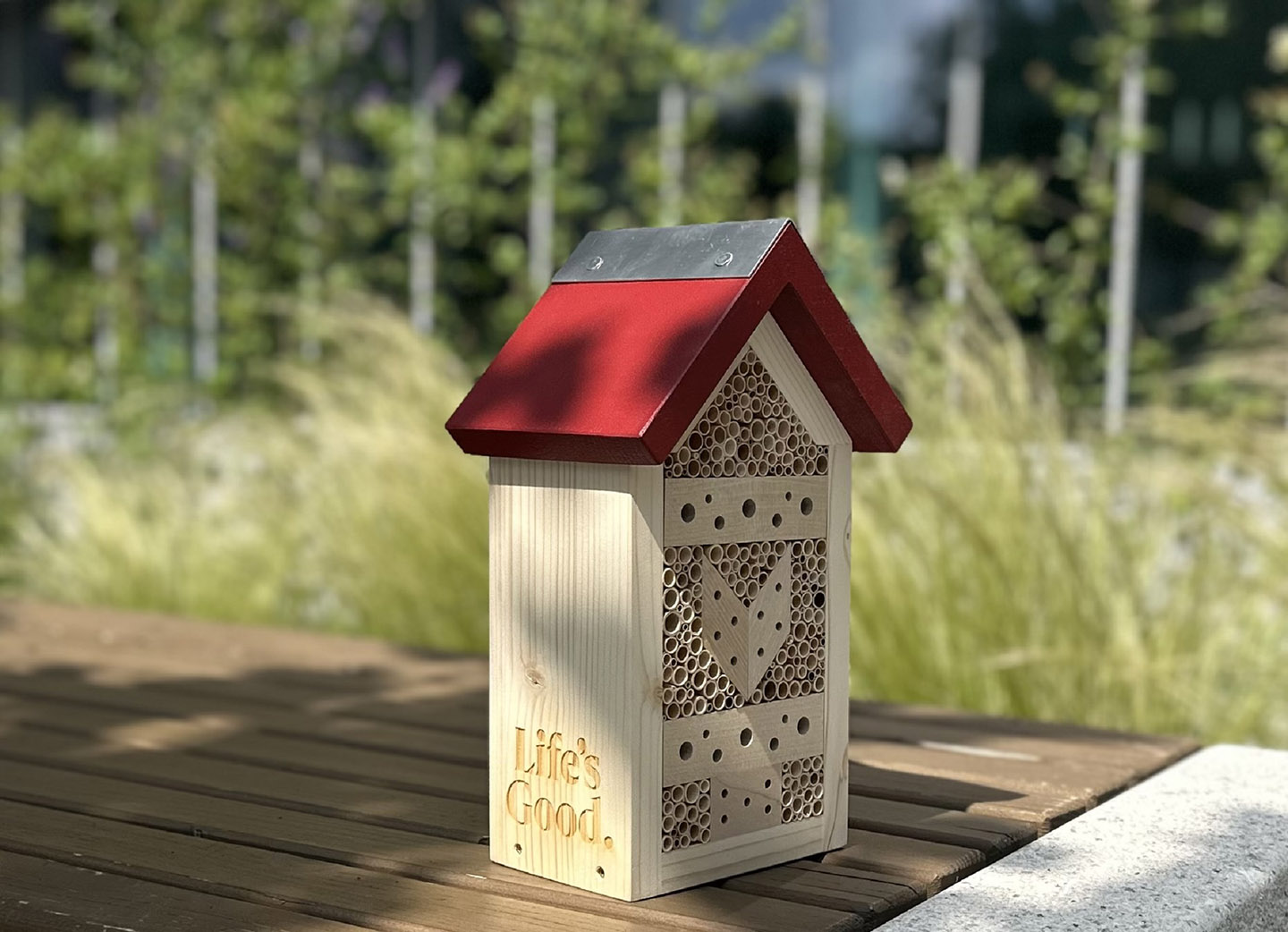 a photo of insect hotel made from sustainable local forestry materials