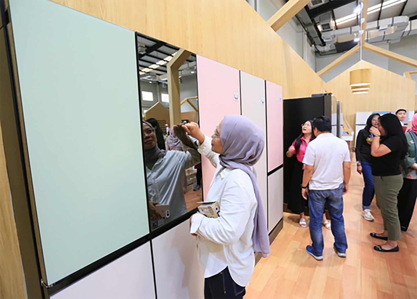 An image of woman looking at the LG InstaView™ French Door refrigerator