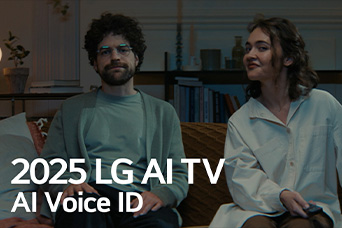 Title is seen, 2025 LG AI TV, Al Voice ID. A man and woman, holding a TV remote, are seated on a couch.	