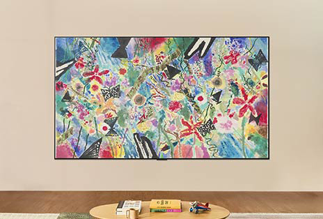 In a bright, well-lit room, the LG TV's screen shows an equally bright artwork showcasing how screen brightness is optimized for viewing in any light.