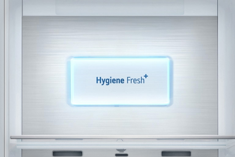 A video starts with a close up view of the "Hygiene Fresh+" panel on the refrigerator. Various bacteria fly around and then everything is sucked into the "Hygiene Fresh+" panel and a light shines across the panel.