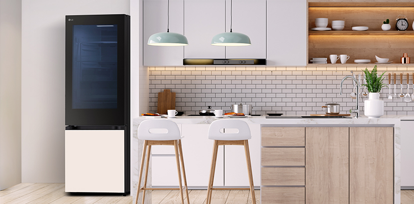 The overall view of  lg bottom freezer refrigerator with instaview in a kitchen.	
