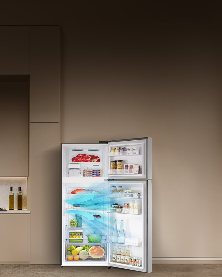 Modern kitchen interiror with a large open lg top freezer refrigerator stocked with various food item explaining how the door cooling feature works.	