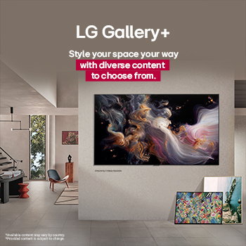 Spacious living room with a view of a cityscape. LG OLED TV is mounted on the wall with an LG Soundbar. The TV's One Wall Design allows it to be flush-fit against the wall and blend well with the space. Zero Connect Box is visible, but concealed. 