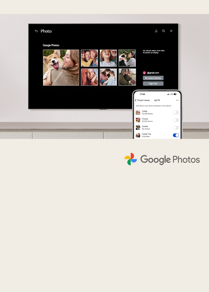 A wall-mounted LG TV with a cellphone in the foreground. The process of setting up Google Photos on the LG TV is shown. 	