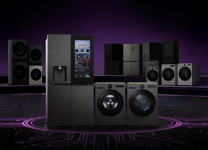 Lineup of LG home appliances including refrigerators, washing machines, dryers, and kitchen appliances displayed on a dark stage with a circuit board pattern floor