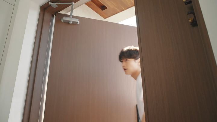 MINHO relaxing in the living room with LG products