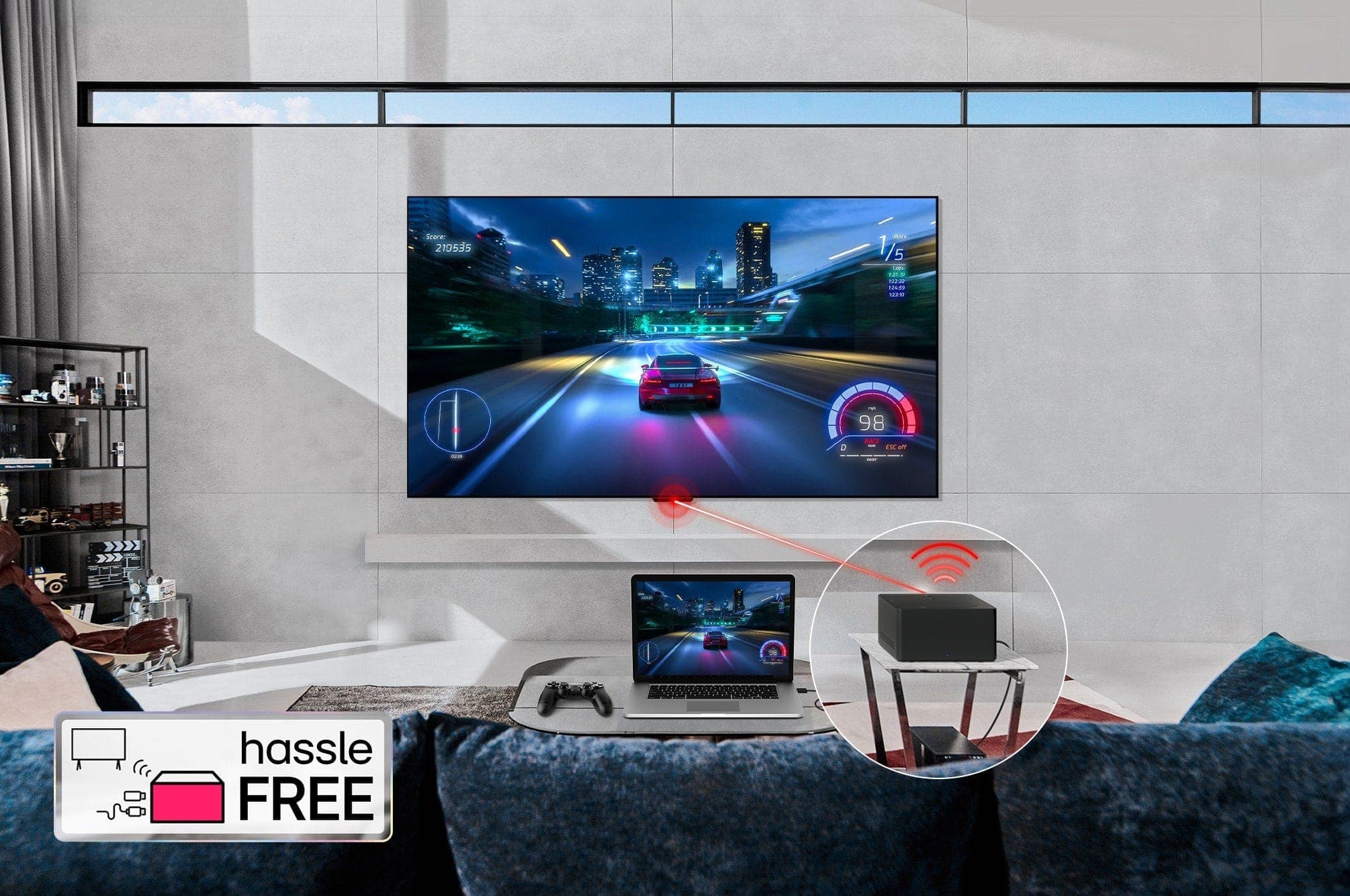 An LG OLED evo M4 mounted on a living room wall and a laptop on a table in front displaying the same car racing game. A close-up of a Zero Connect Box on a smaller table, with a console connected underneath and a red Wi-Fi signal and red beam emitting towards the TV. The words "hassle FREE" in the bottom left corner.