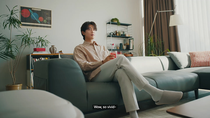 MINHO relaxing in the living room with LG products