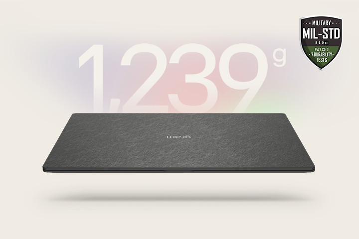 An animation showcasing a lightweight laptop with '1,239g' displayed in the first frame and '12.4mm' thickness in the second frame. Both frames include the MIL-STD durability badge, emphasizing portability and durability.