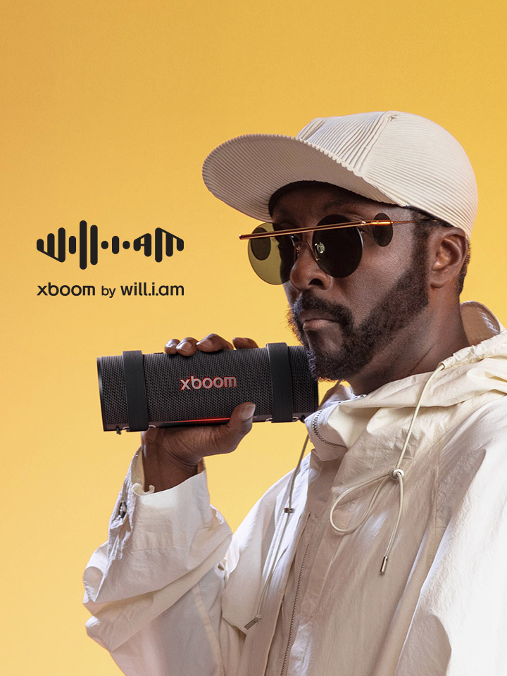 will.i.am in white outfit is holding xboom Grab.