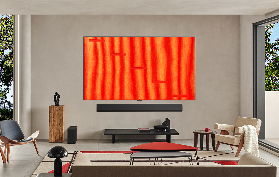 Living room with a wall-mounted LG TV. The screen features one of the many artworks available on LG Gallery+ 