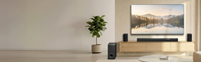 LG wireless speakers US80TR in a cozy sitting room environment, placing under the LG TV large screen with a nature  scenery screen fill