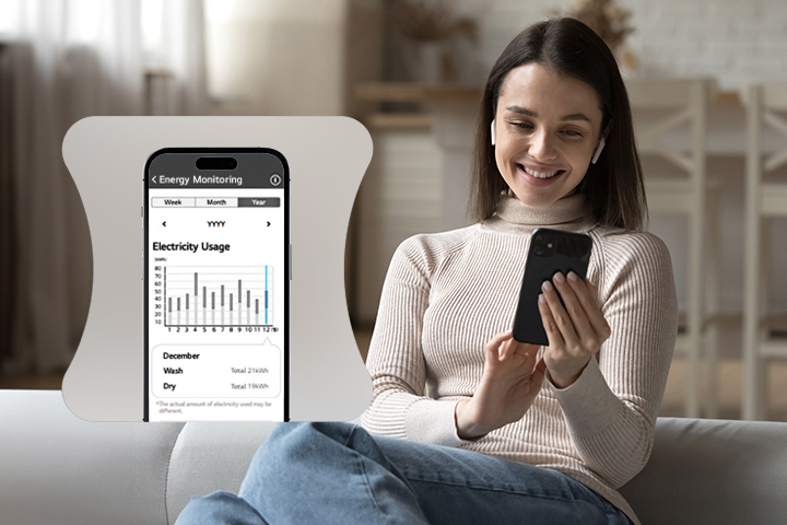 A woman monitoring her energy usage through a ThinQ app.	