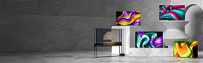A range of LG TVs in various sizes and designs are displayed in a modern concrete space, with vibrant abstract graphics shown on their screens.