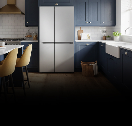 A silver side-by-side refrigerator with a minimalist design installed in a kitchen.